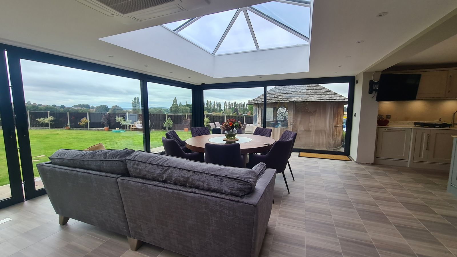 Orangery interior with roof lantern and bi-fold doors