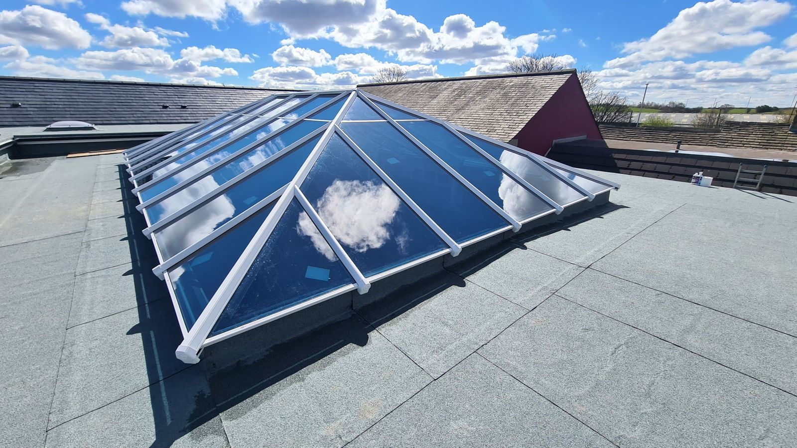 Large roof lantern installation on a flat roof