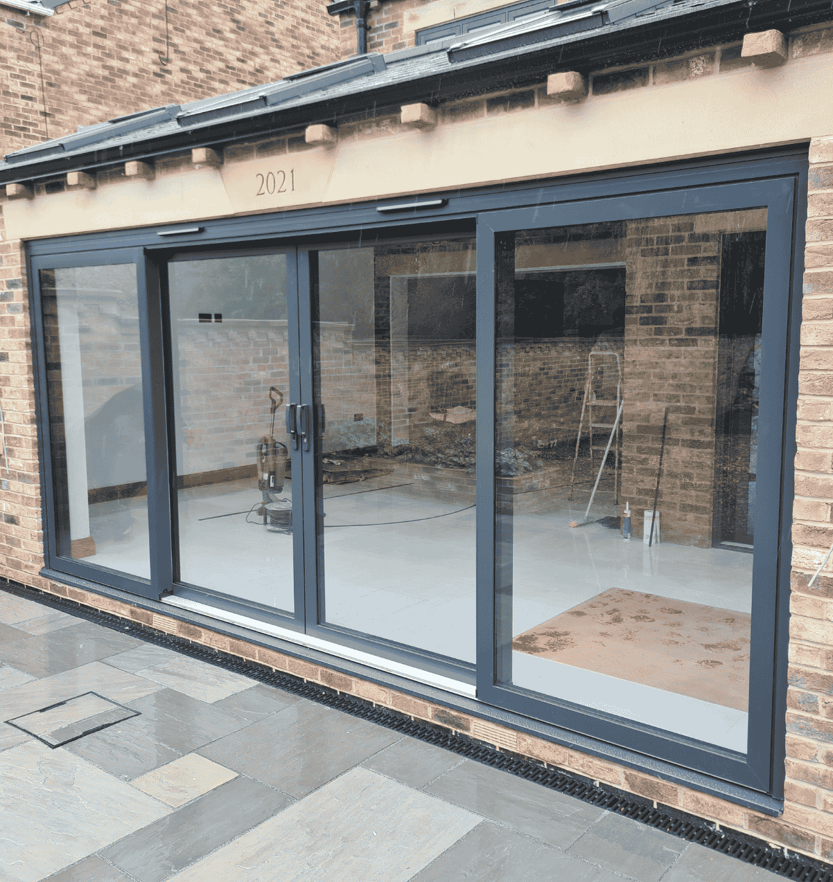 Anthracite grey aluminium bifold doors on a modern extension