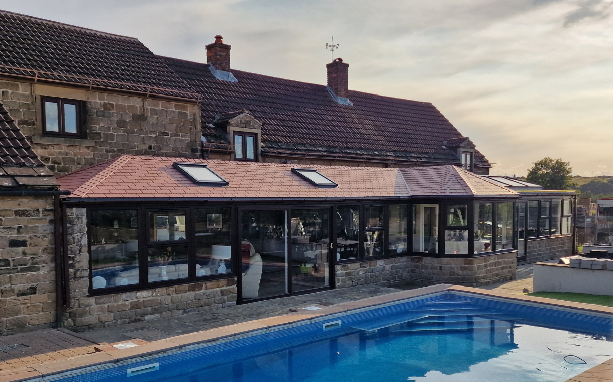 Large solid roof conservatory with pool